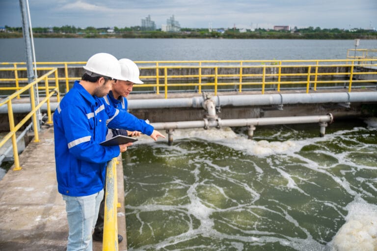 Engineers Inspecting Water Treatment System and Industrial Waste